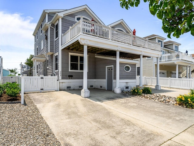 364 41st St E, Unit East, Avalon, NJ 08202 - view of front facade with crawl space, a gate, and a deck
