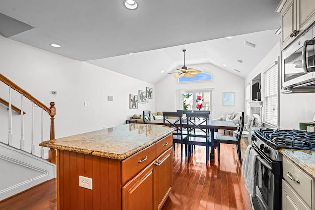 364 41st St E, Unit East, Avalon, NJ 08202 - kitchen with appliances with stainless steel finishes, open floor plan, dark wood finished floors, ceiling fan, and lofted ceiling