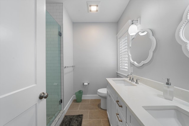 full bathroom with toilet, a sink, a shower stall, tile patterned flooring, and baseboards