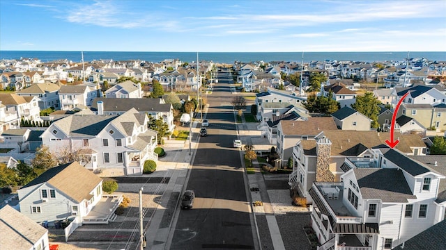 bird's eye view with a water view and a residential view