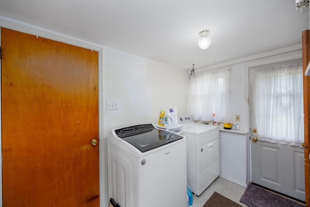 washroom featuring washer and clothes dryer