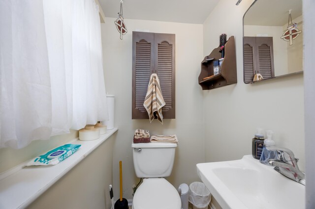 bathroom featuring sink and toilet