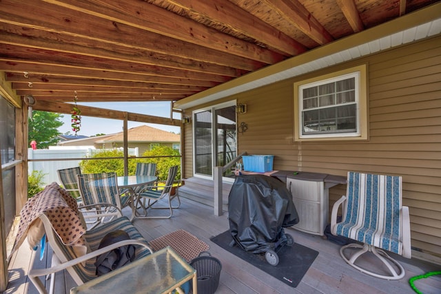 view of patio with area for grilling and a deck