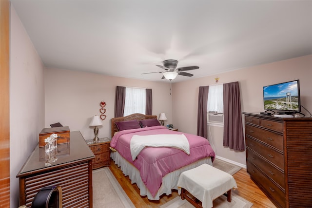 bedroom featuring ceiling fan and light hardwood / wood-style floors