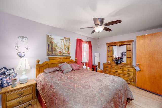 bedroom featuring ceiling fan and light hardwood / wood-style floors