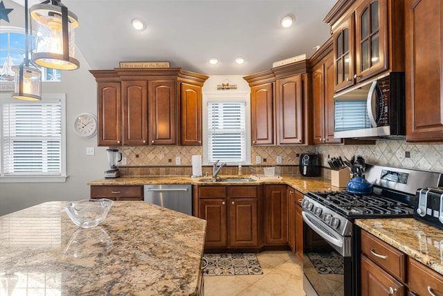32 47th St E Unit, East Unit, Sea Isle City, NJ 08243 - kitchen with stainless steel appliances, backsplash, light stone countertops, glass insert cabinets, and recessed lighting