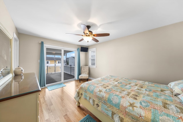 32 47th St E Unit, East Unit, Sea Isle City, NJ 08243 - bedroom with access to outside, light wood-style flooring, and ceiling fan
