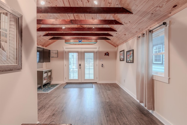 foyer with wood finished floors, french doors, wooden ceiling, baseboards, and vaulted ceiling with beams