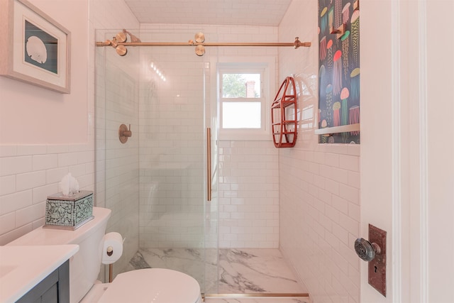 bathroom featuring a shower stall, tile walls, and vanity