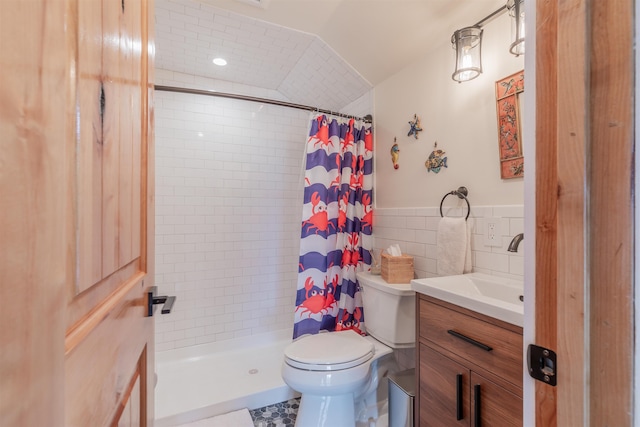 full bathroom featuring toilet, tile walls, vanity, and a tile shower