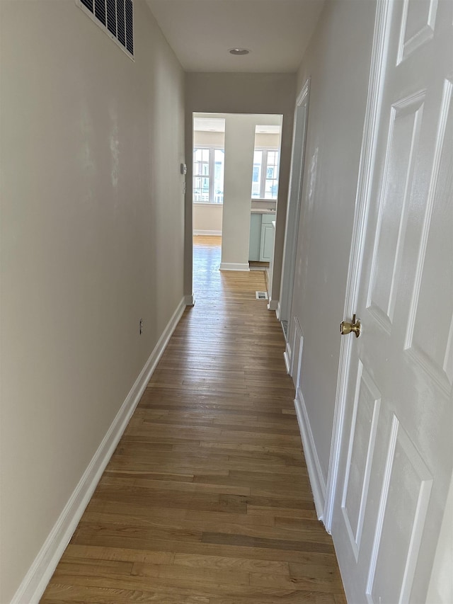 hallway featuring hardwood / wood-style floors