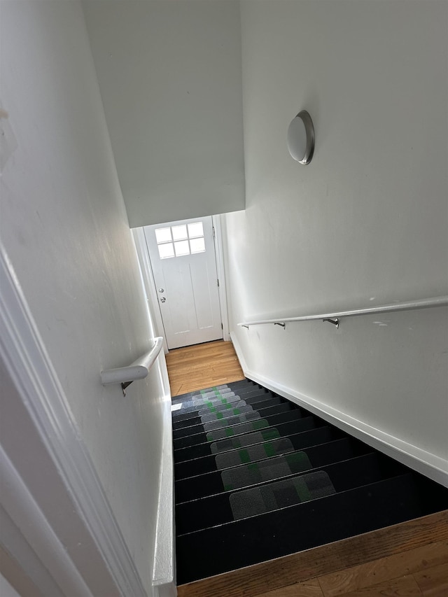 stairs with wood-type flooring