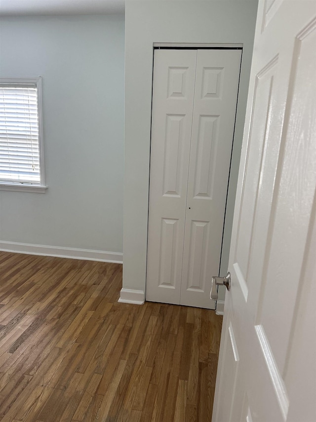 empty room featuring dark wood-type flooring