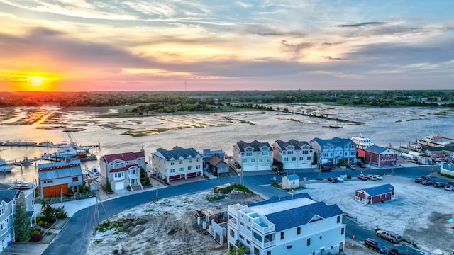 aerial view at dusk with a water view