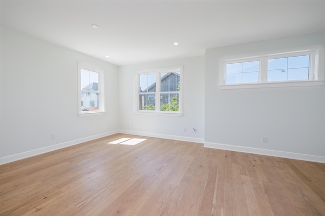 spare room with light wood-type flooring