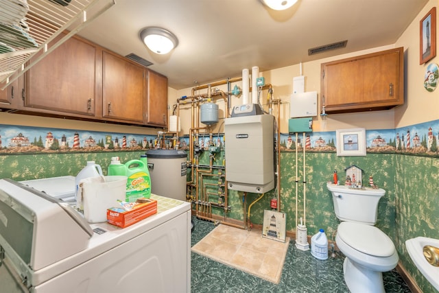 laundry room featuring washer and dryer and gas water heater