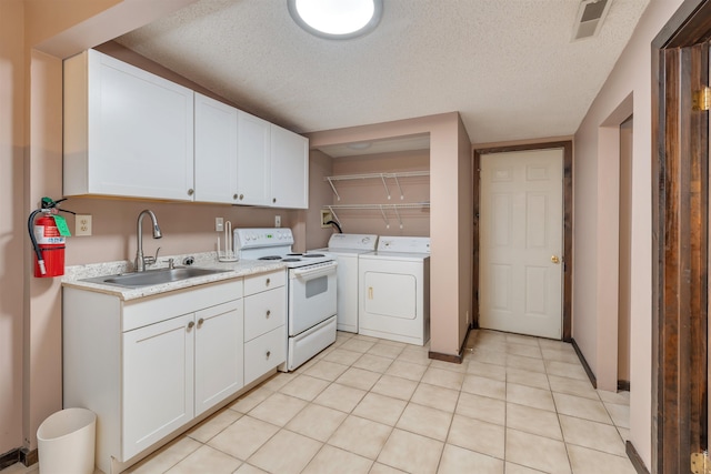 kitchen featuring white range with electric cooktop, white cabinetry, sink, and a textured ceiling