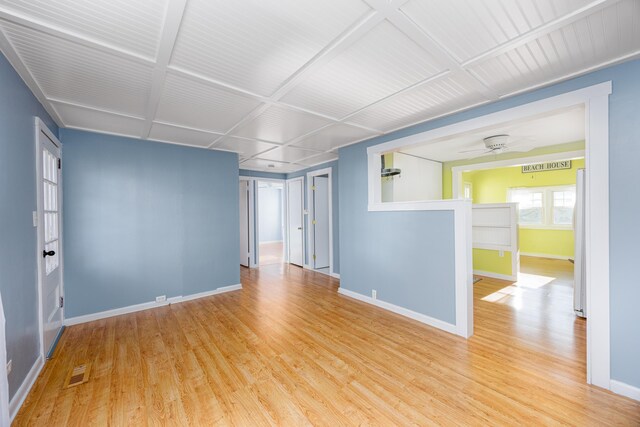 unfurnished room featuring hardwood / wood-style flooring and ceiling fan