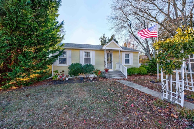 view of front of home with a front yard