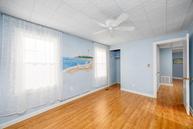 spare room with ceiling fan and light hardwood / wood-style flooring