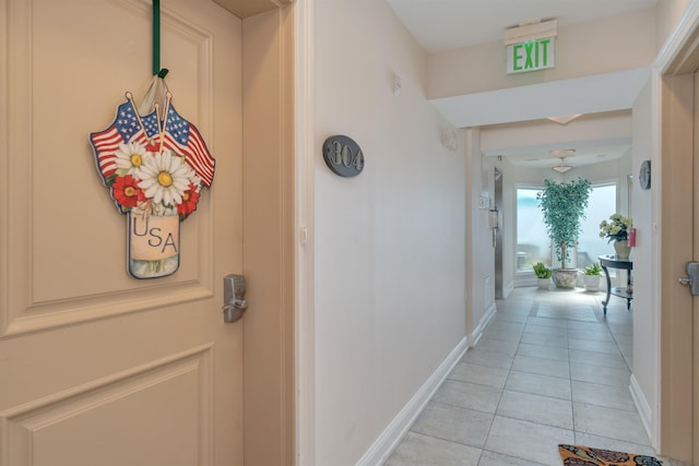 hallway featuring light tile patterned floors