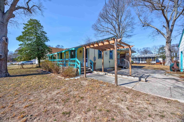 exterior space featuring a porch and a pergola