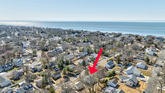 bird's eye view featuring a residential view and a water view