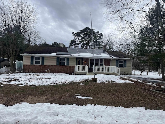 single story home with a porch