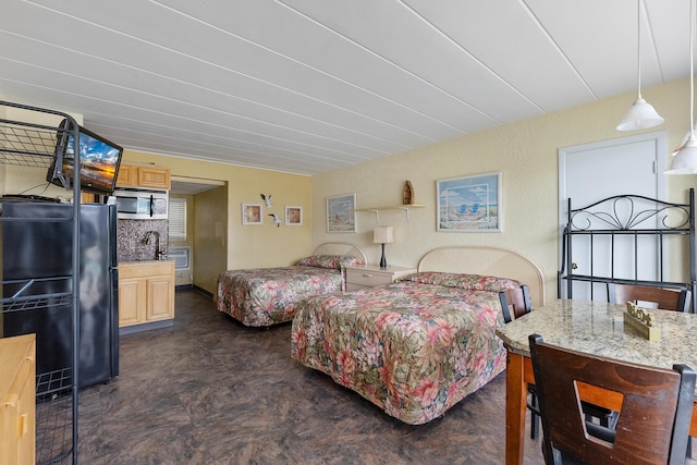 bedroom with refrigerator