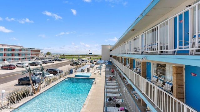 view of swimming pool with a patio area