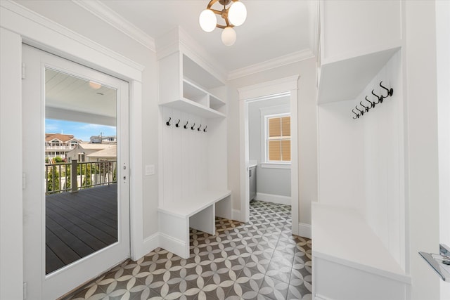 mudroom with ornamental molding, baseboards, and tile patterned floors