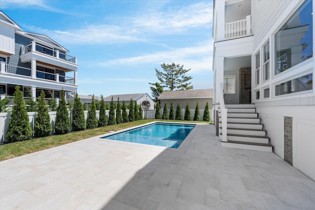 view of swimming pool featuring a fenced in pool, a patio, and fence