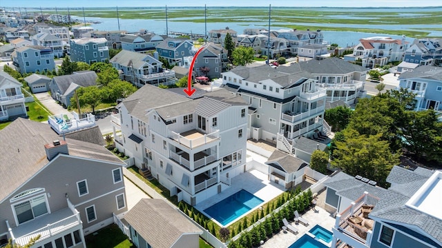 aerial view featuring a residential view and a water view