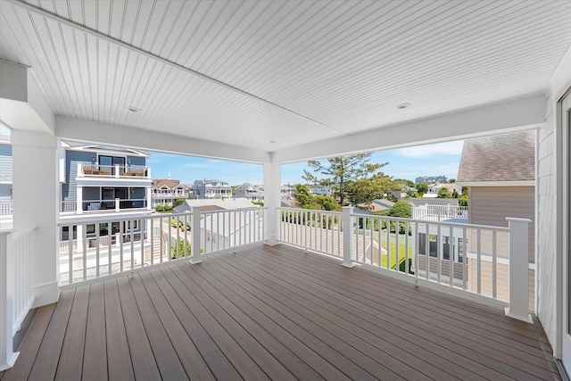 wooden terrace featuring a residential view