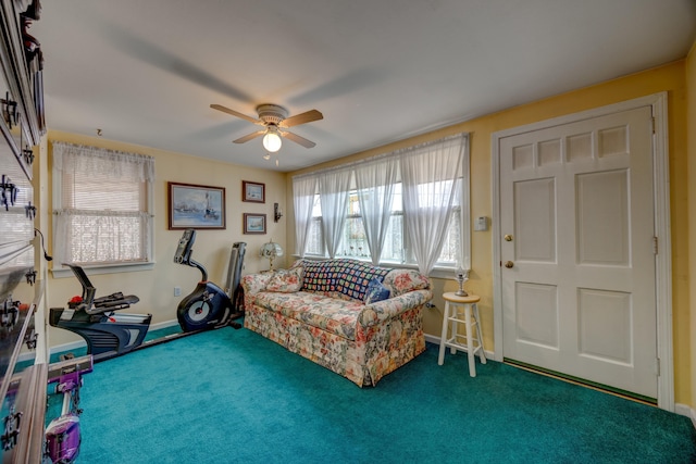 interior space with ceiling fan and carpet