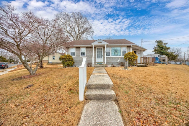 bungalow-style house with a front yard