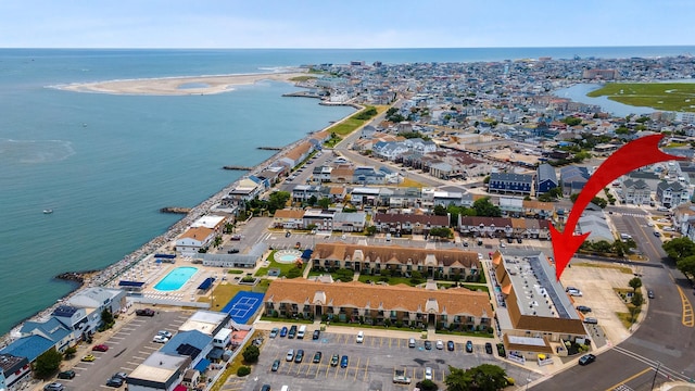 birds eye view of property featuring a water view