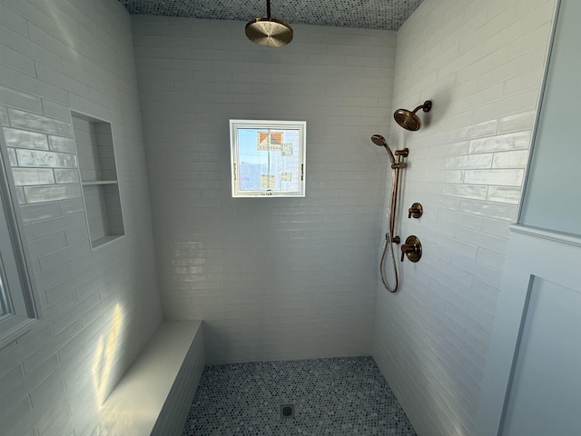 bathroom featuring tiled shower