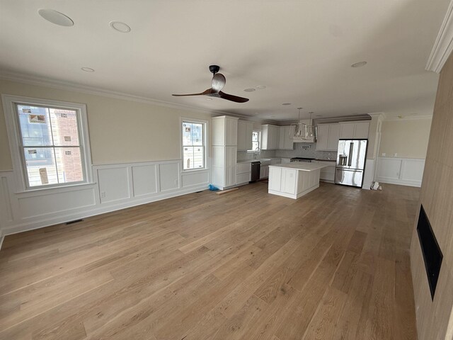 unfurnished bedroom featuring lofted ceiling and hardwood / wood-style floors