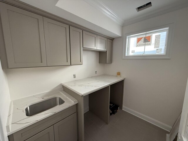 stairway featuring ornamental molding and concrete flooring