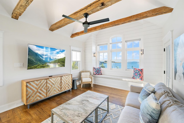 living room with vaulted ceiling with beams, ceiling fan, and dark wood-type flooring