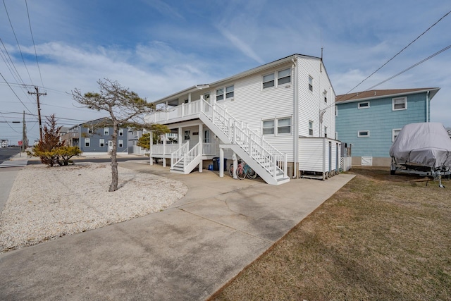 3817 Central Ave Unit 1St, Sea Isle City, NJ 08243 - back of property with stairway and a lawn