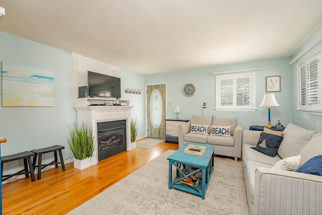 3817 Central Ave Unit 1St, Sea Isle City, NJ 08243 - living room featuring wood finished floors and a glass covered fireplace
