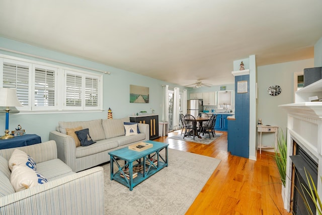 3817 Central Ave Unit 1St, Sea Isle City, NJ 08243 - living room featuring a fireplace, light wood finished floors, and ceiling fan