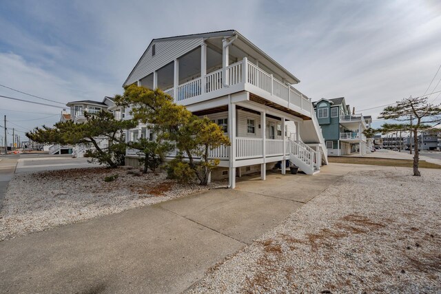 3817 Central Ave Unit 1St, Sea Isle City, NJ 08243 - view of property exterior with a balcony and a porch