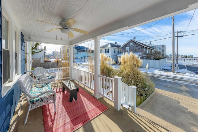 wooden deck with ceiling fan and a porch