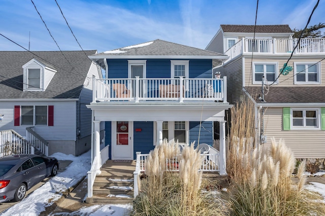 view of front of home with a balcony