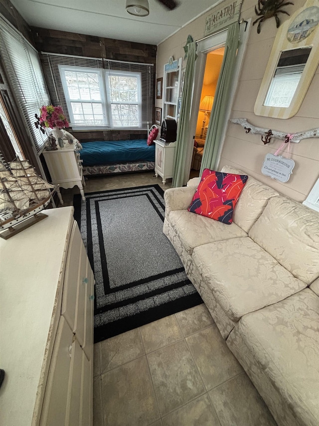 living area with tile patterned floors
