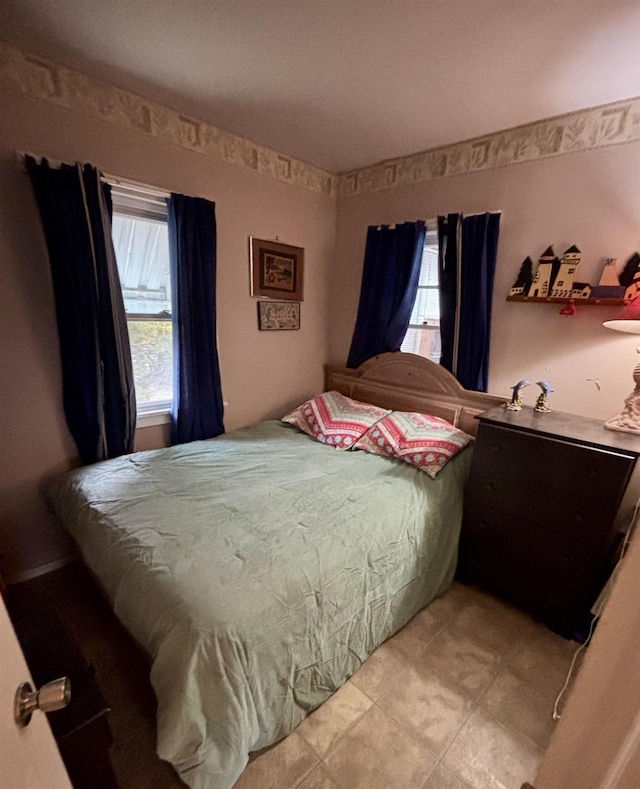 bedroom featuring multiple windows