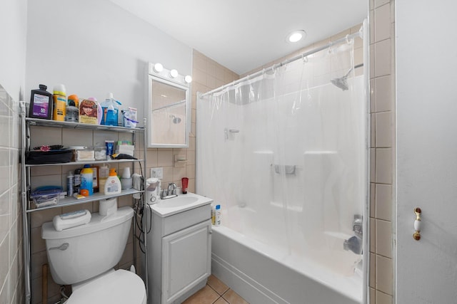 full bathroom with tile patterned floors, toilet, decorative backsplash, vanity, and shower / tub combo